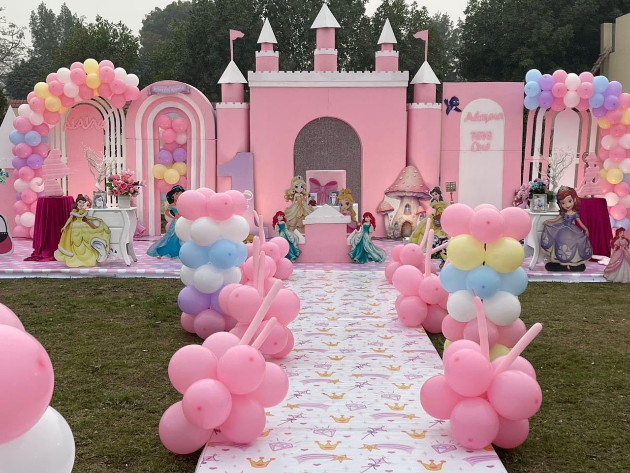 Mahveen's pink castle and balloon birthday setup